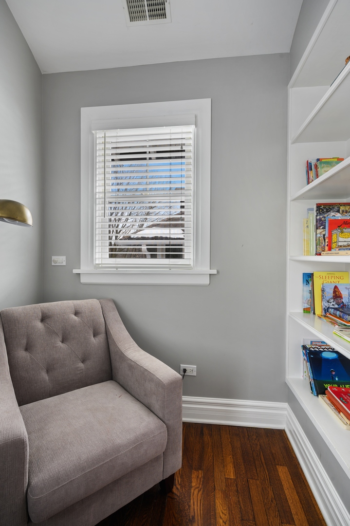 1054 Tower Road Winnetka, IL 60093 - Photo 23 of 32 a living room with furniture and a window