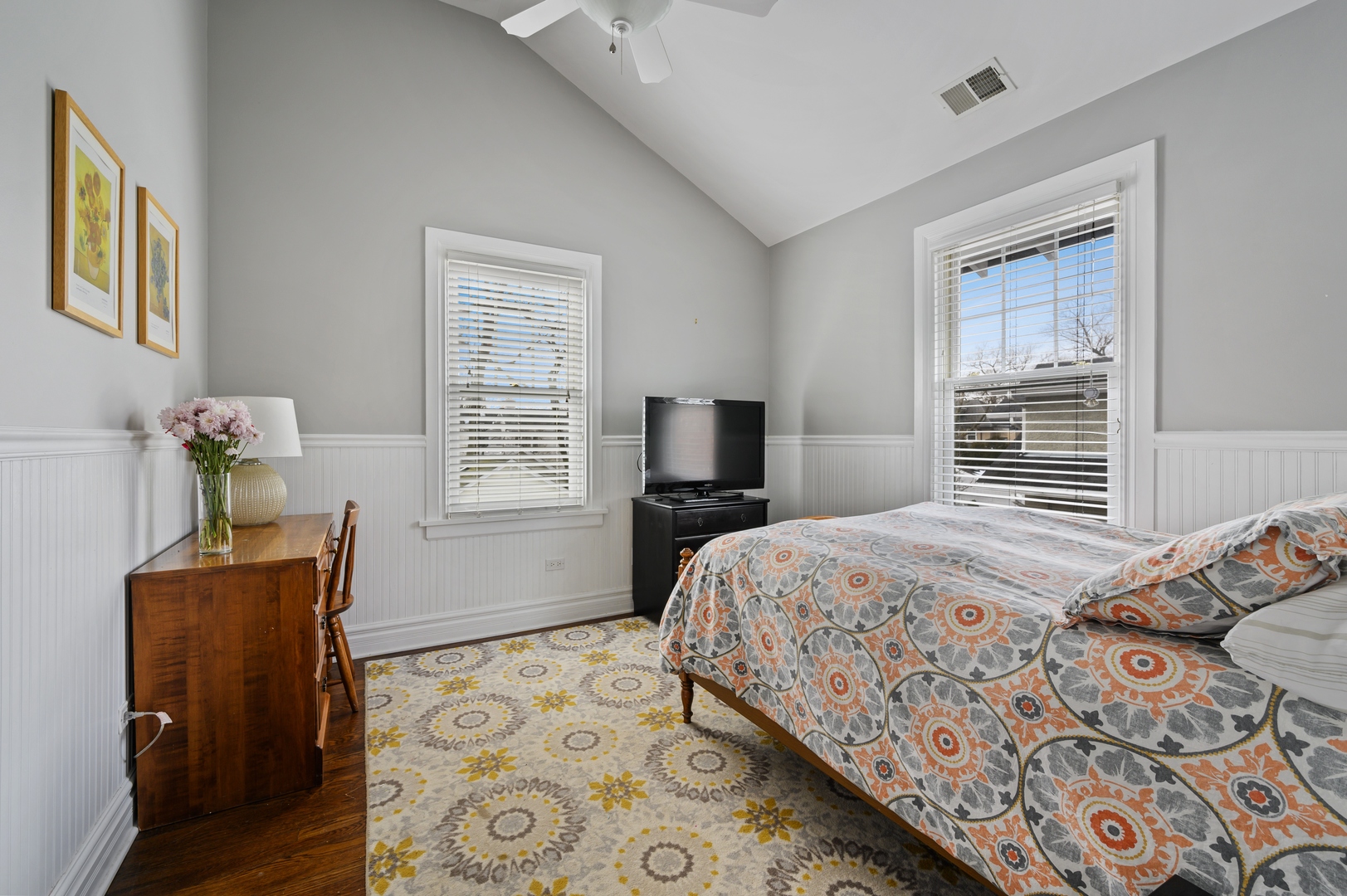 1054 Tower Road Winnetka, IL 60093 - Photo 24 of 32 a bedroom with a bed and wooden floor