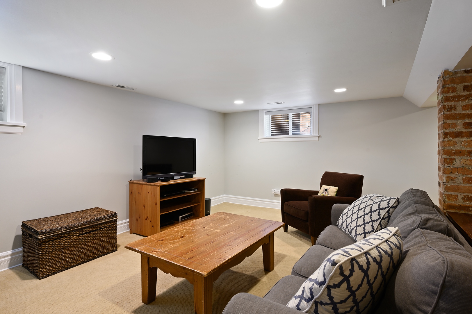 1054 Tower Road Winnetka, IL 60093 - Photo 25 of 32 a living room with furniture and a flat screen tv