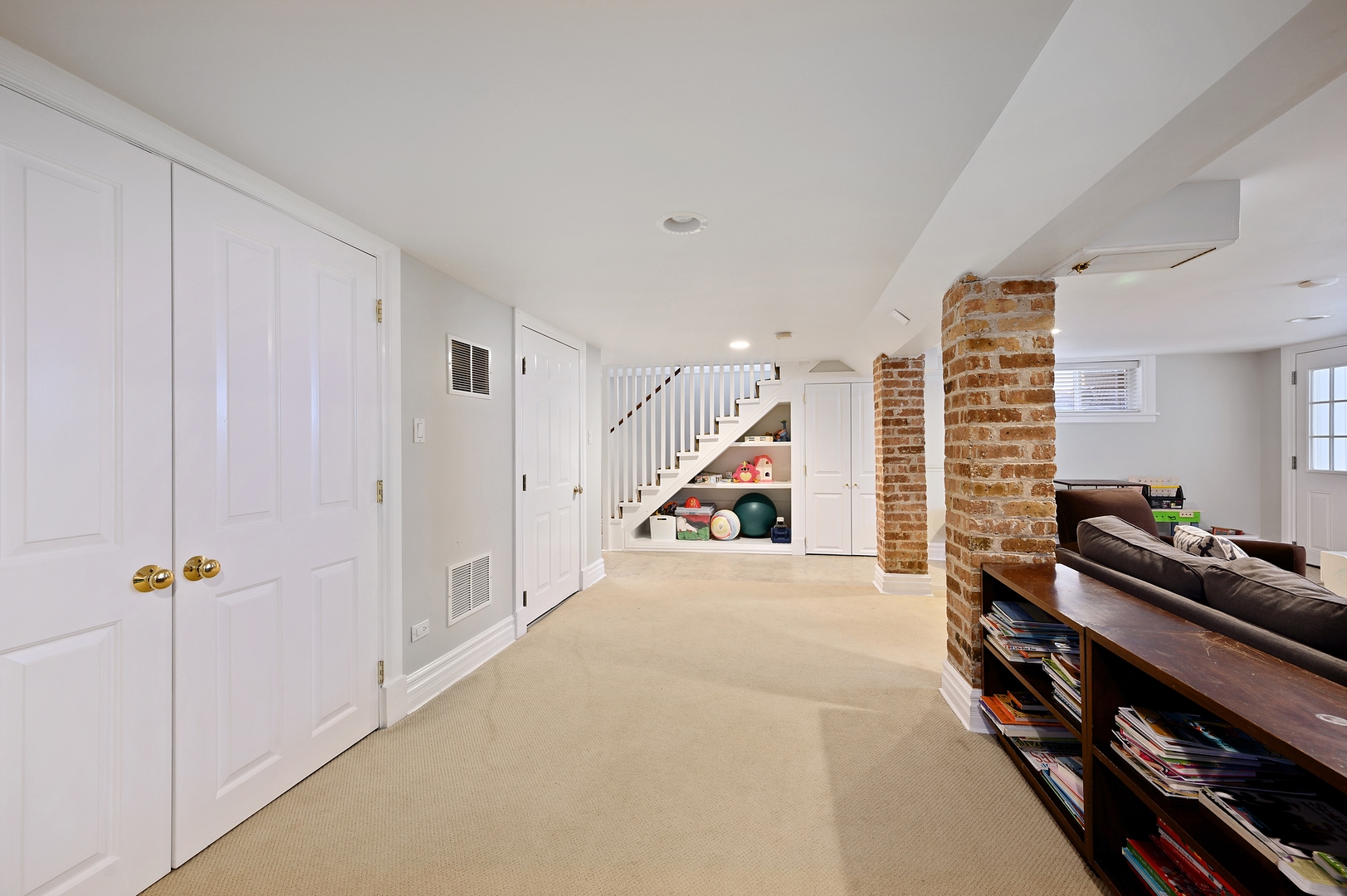 1054 Tower Road Winnetka, IL 60093 - Photo 27 of 32 a view of a livingroom with furniture and stairs