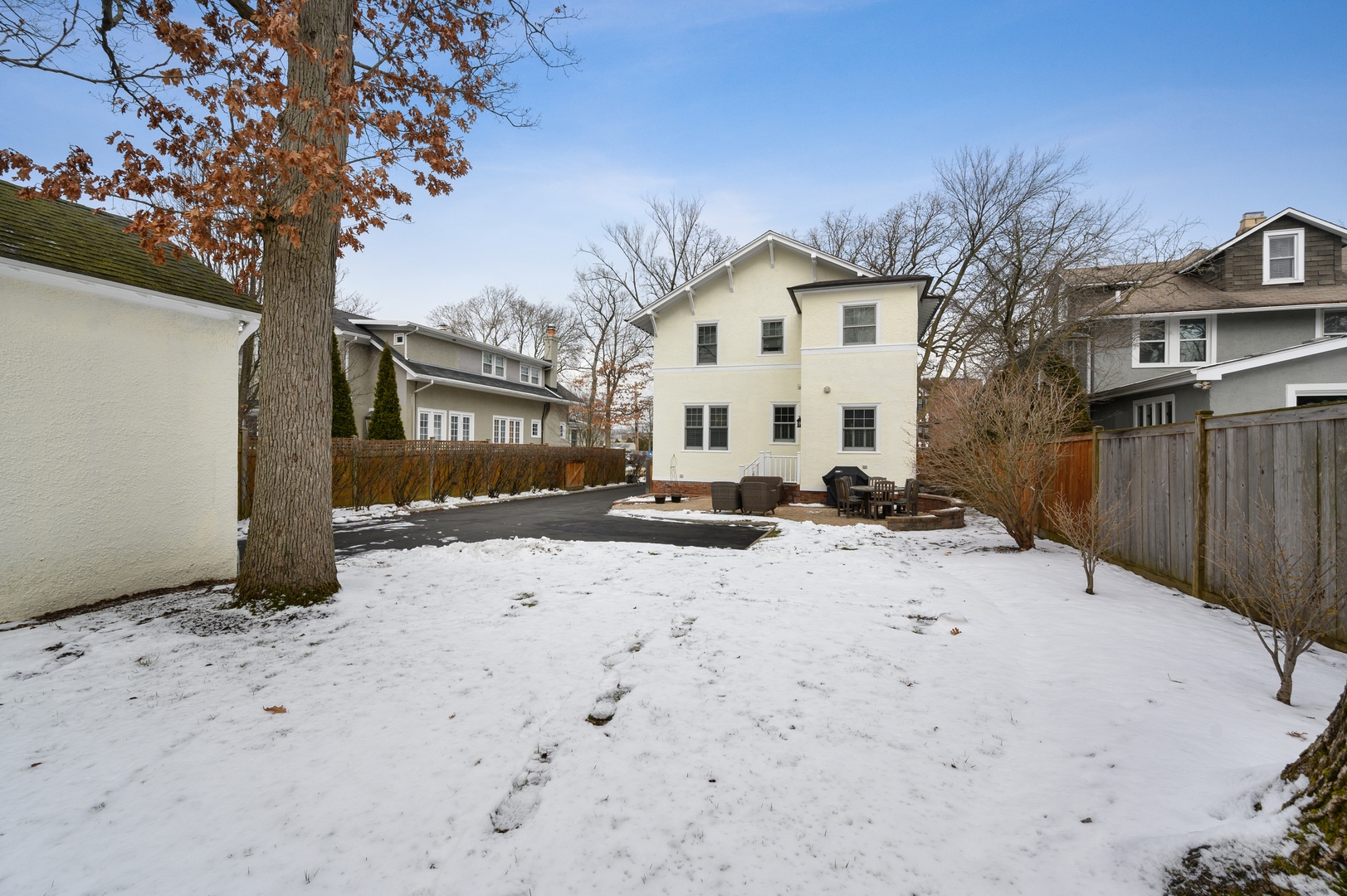 1054 Tower Road Winnetka, IL 60093 - Photo 32 of 32 a view of a white house with a snow in the yard