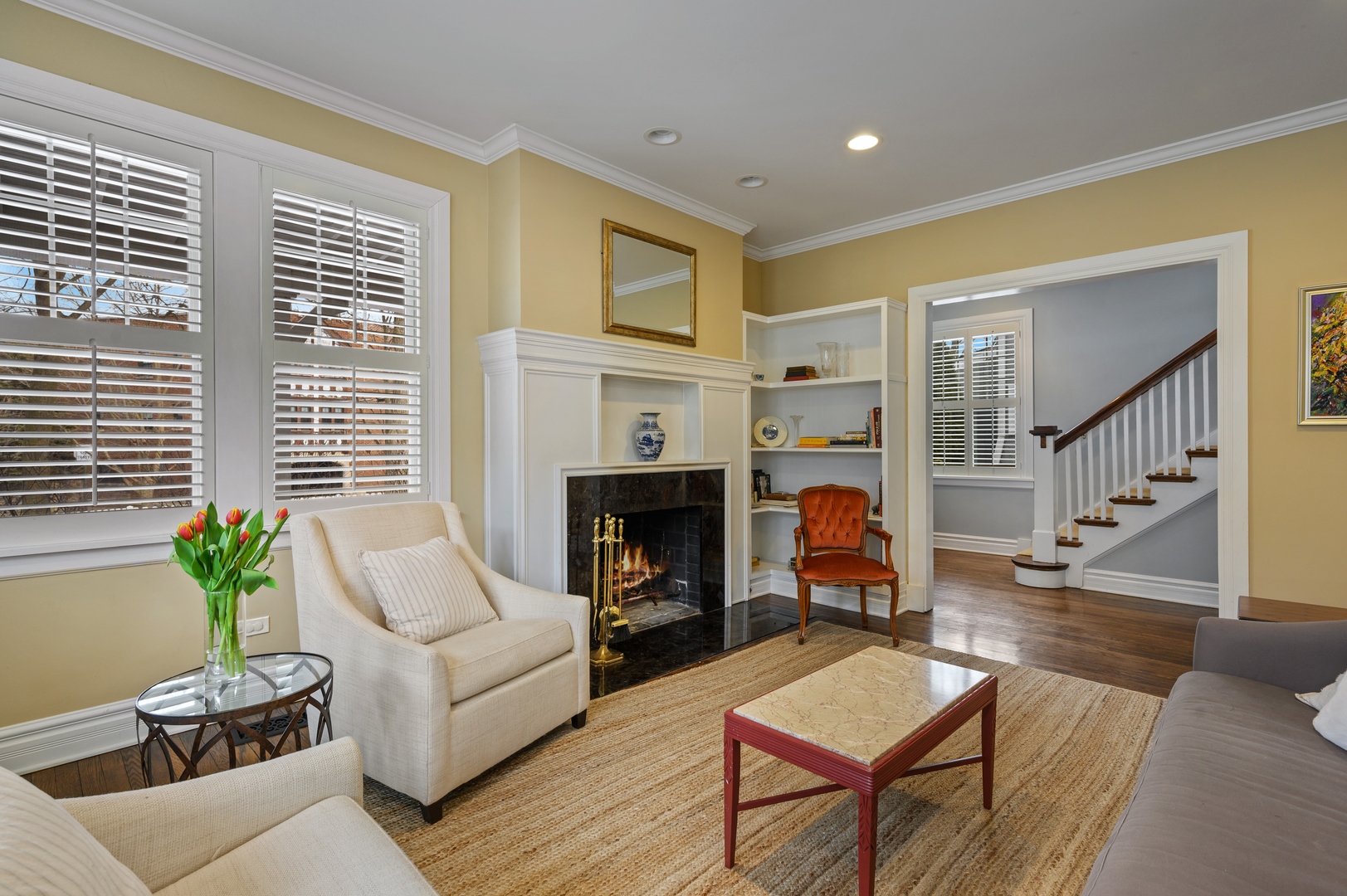 1054 Tower Road Winnetka, IL 60093 - Photo 8 of 32 a living room with furniture and a fireplace