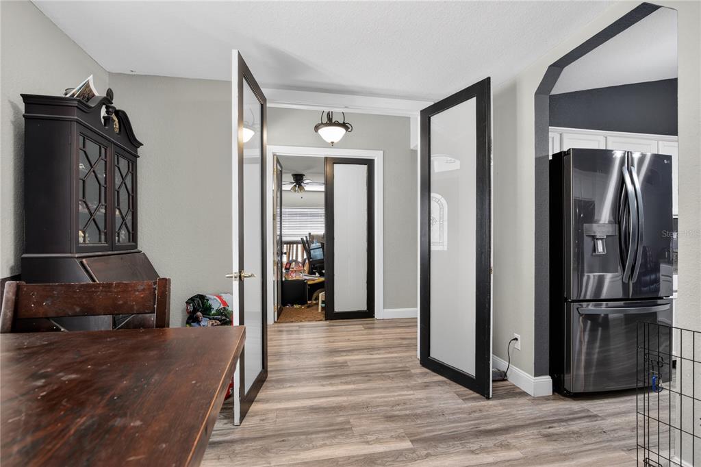 105 Pecan Pass Ocala, FL 34472 - Photo 13 of 25 a view of hallway with walk in closet and wooden floor