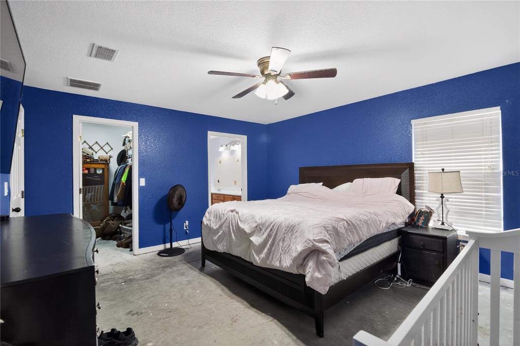 105 Pecan Pass Ocala, FL 34472 - Photo 15 of 25 a bed sitting in a bedroom next to a window