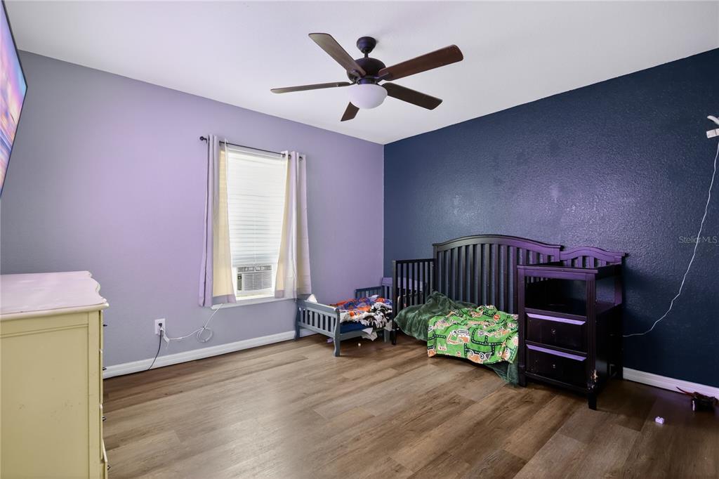 105 Pecan Pass Ocala, FL 34472 - Photo 18 of 25 a bed room with furniture and a window