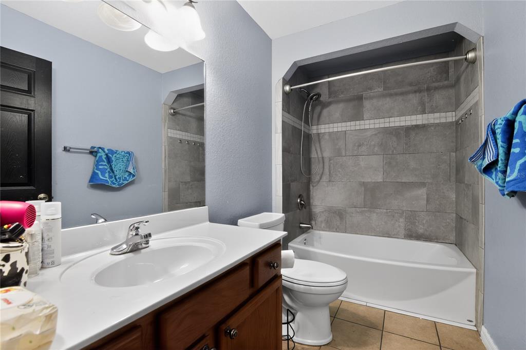 105 Pecan Pass Ocala, FL 34472 - Photo 20 of 25 a bathroom with a sink a toilet and shower