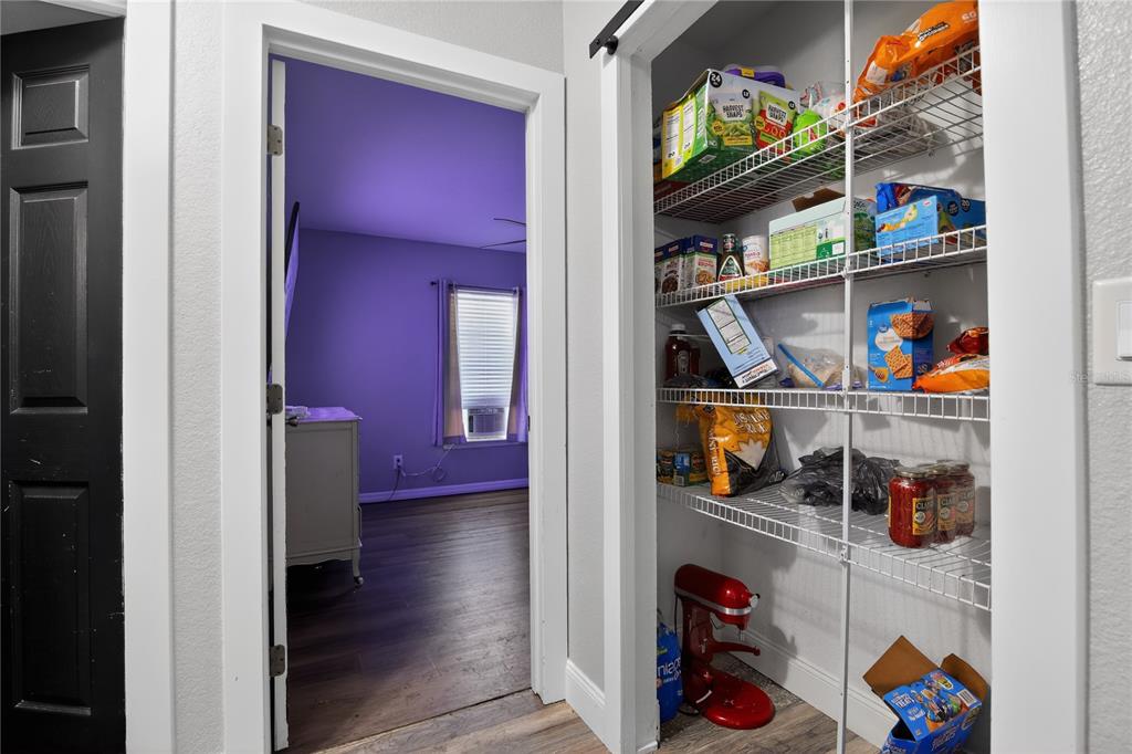 105 Pecan Pass Ocala, FL 34472 - Photo 23 of 25 a view of walk in closet with clothes and shoes