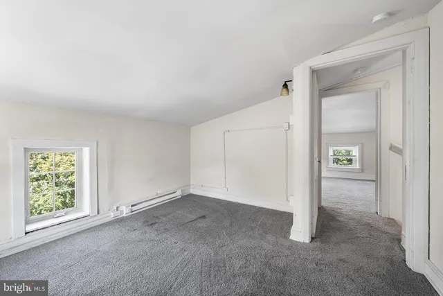 a view of a backyard with sitting area