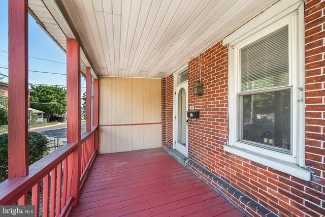 a view of a balcony with wooden floor