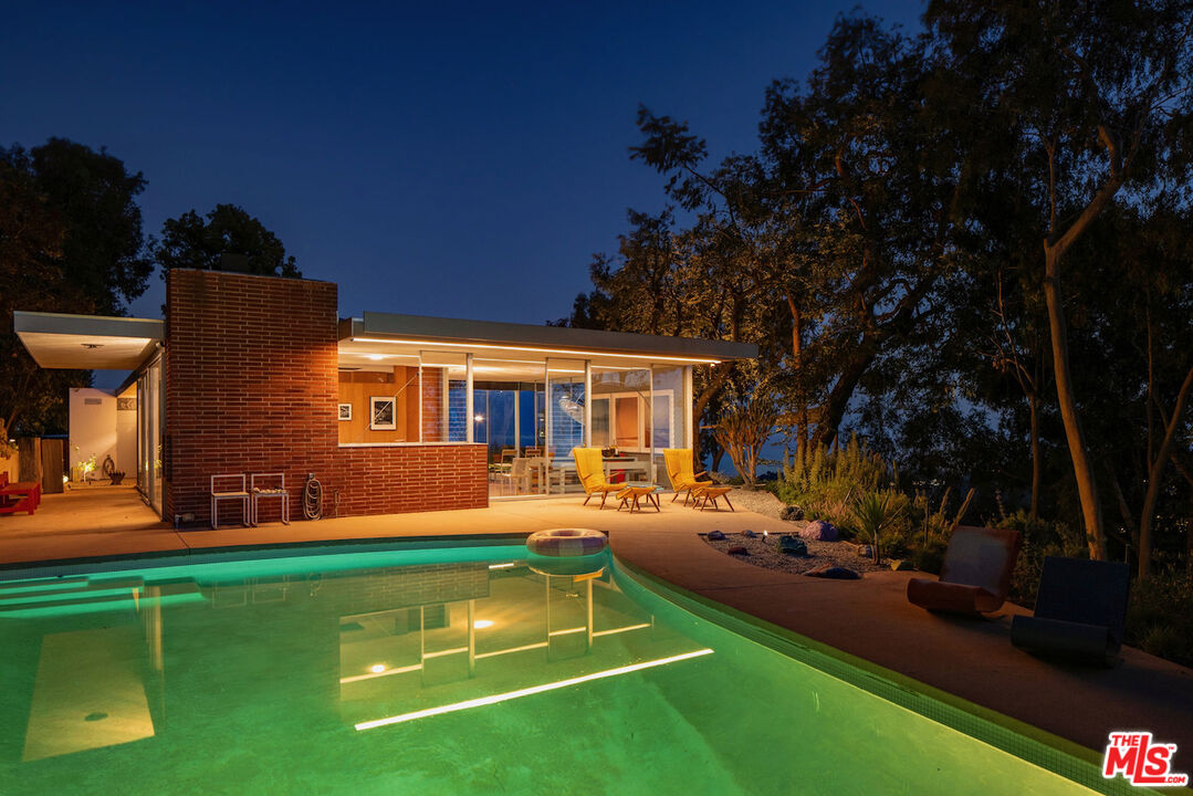 1531 North Tigertail Road Los Angeles, CA 90049 - Photo 9 of 24 a front view of house with yard and outdoor seating