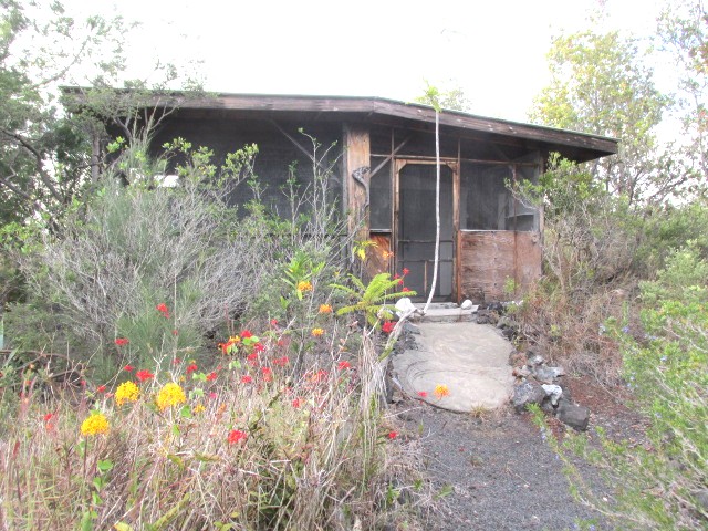 92-8811 Catamaran Lane Ocean View, HI 96704 - Photo 10 of 10 a front view of a house with plants