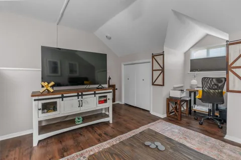 a room with furniture and flat screen tv