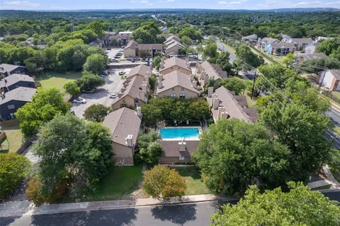 an aerial view of a house with a garden