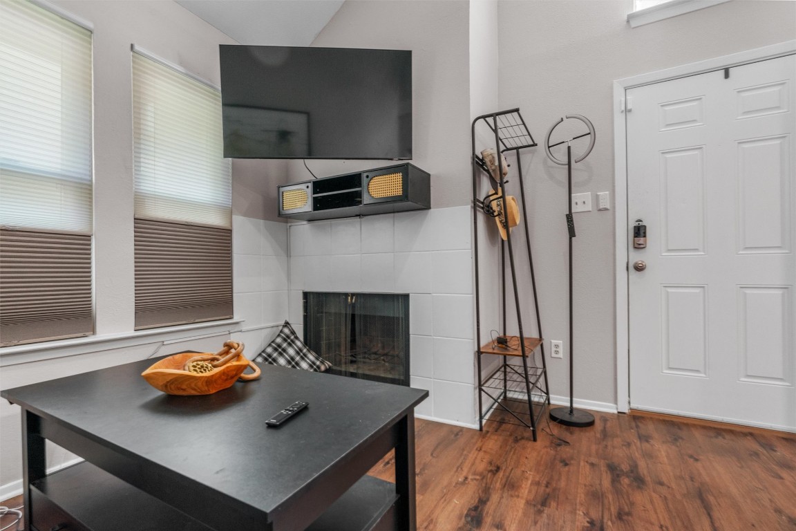 5608 Cougar Drive, Unit 226 Austin, TX 78745 - Photo 10 of 20 a living room with furniture and a fireplace