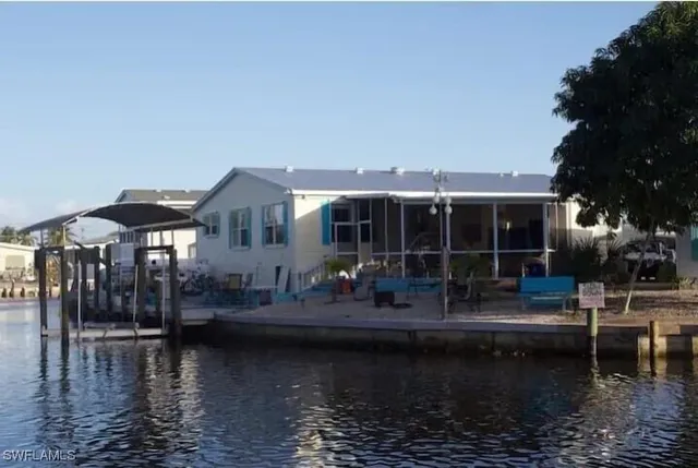 a house view with swimming pool and sitting space
