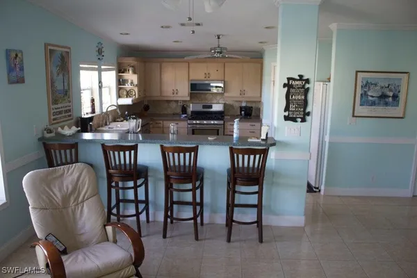 a dining room with furniture and window