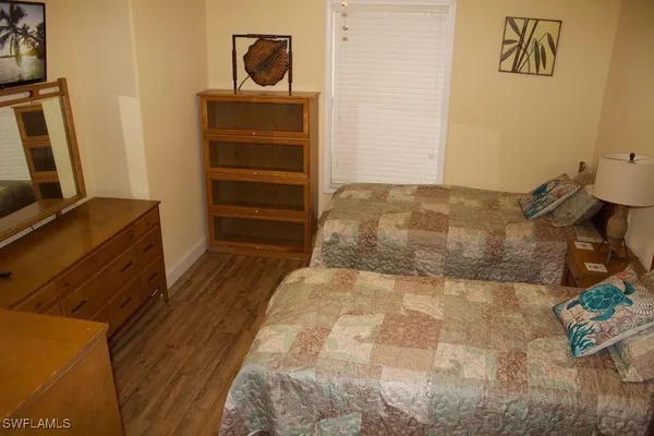 a bed room with furniture and a table