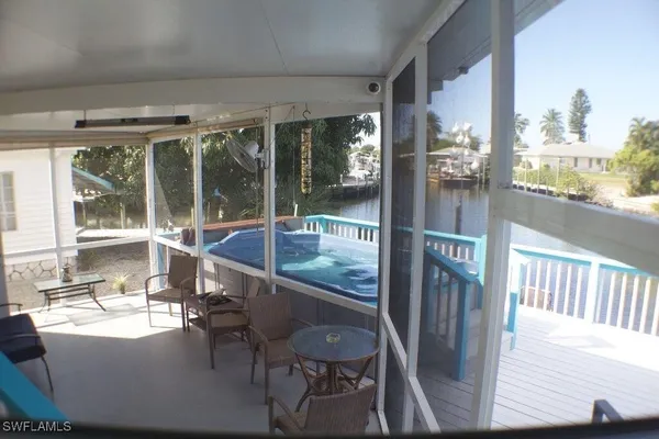 a view of balcony with wooden floor