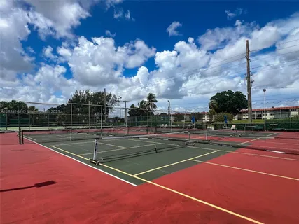 a view of a park with large trees