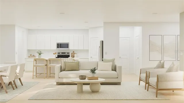 a living room with furniture white walls and white walls