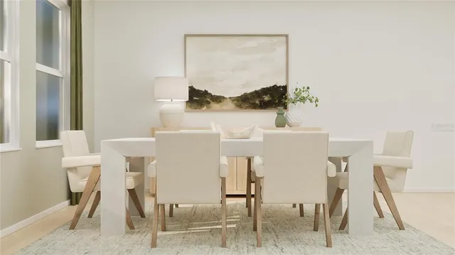 a dining room with furniture and a window