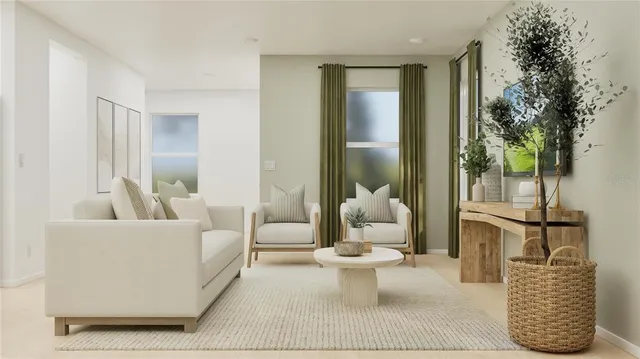 a living room with furniture and a potted plant