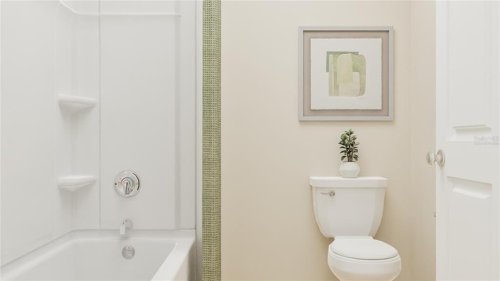 5200 Clay Whaley Road St. Cloud, FL 34772 - Photo 9 of 27 a white toilet sitting next to a bathroom sink