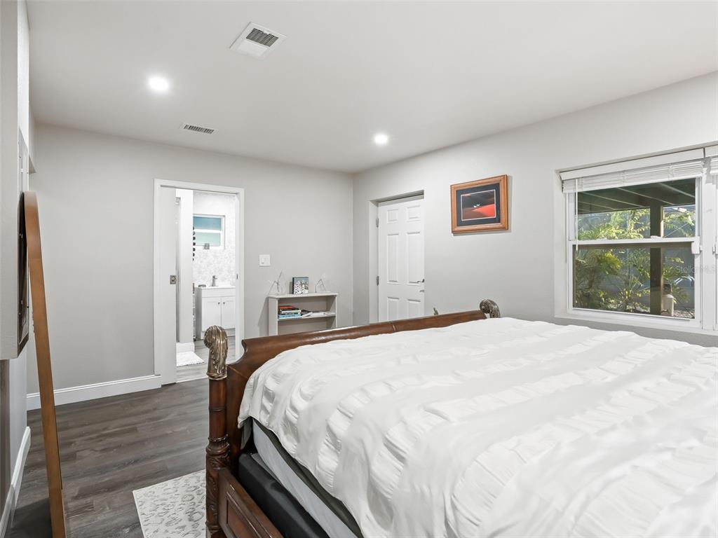 3505 Northeast 97th Street Road Anthony, FL 32617 - Photo 17 of 36 a spacious bedroom with a bed and a window