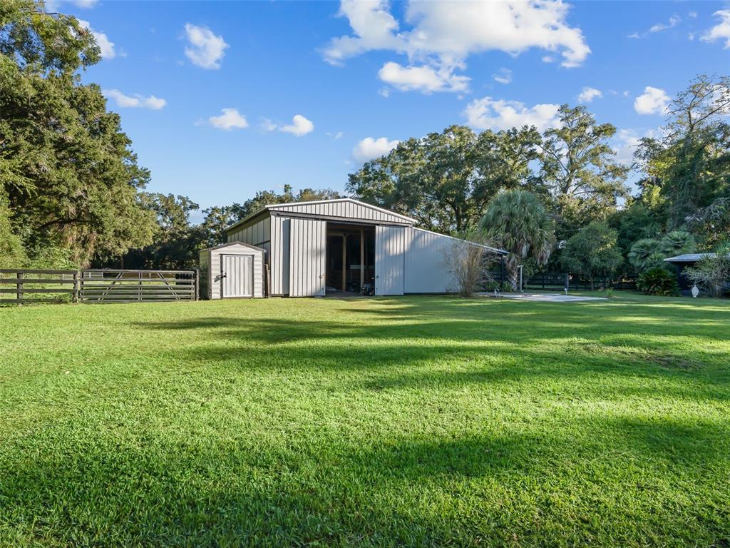 3505 Northeast 97th Street Road Anthony, FL 32617 - Photo 28 of 36 a house view with a garden space
