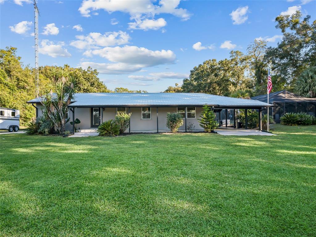 3505 Northeast 97th Street Road Anthony, FL 32617 - Photo 3 of 38 a view of a house with a yard