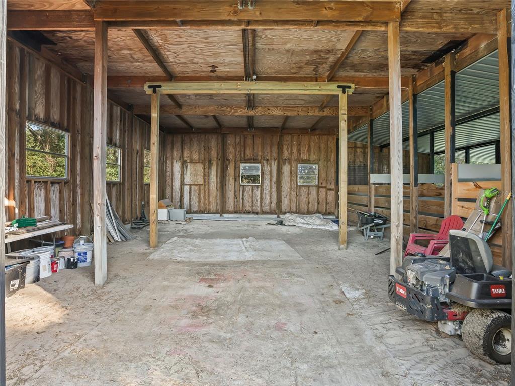 3505 Northeast 97th Street Road Anthony, FL 32617 - Photo 31 of 38 a view of a garage with cars