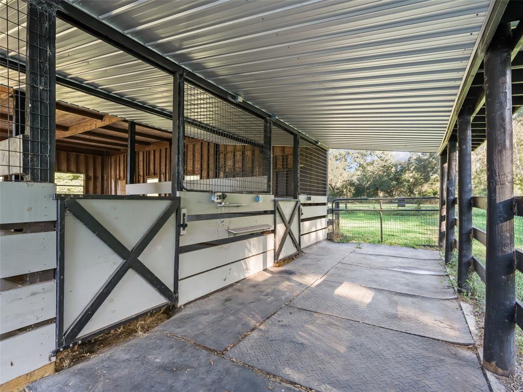 3505 Northeast 97th Street Road Anthony, FL 32617 - Photo 32 of 38 a view of a porch with furniture and garden