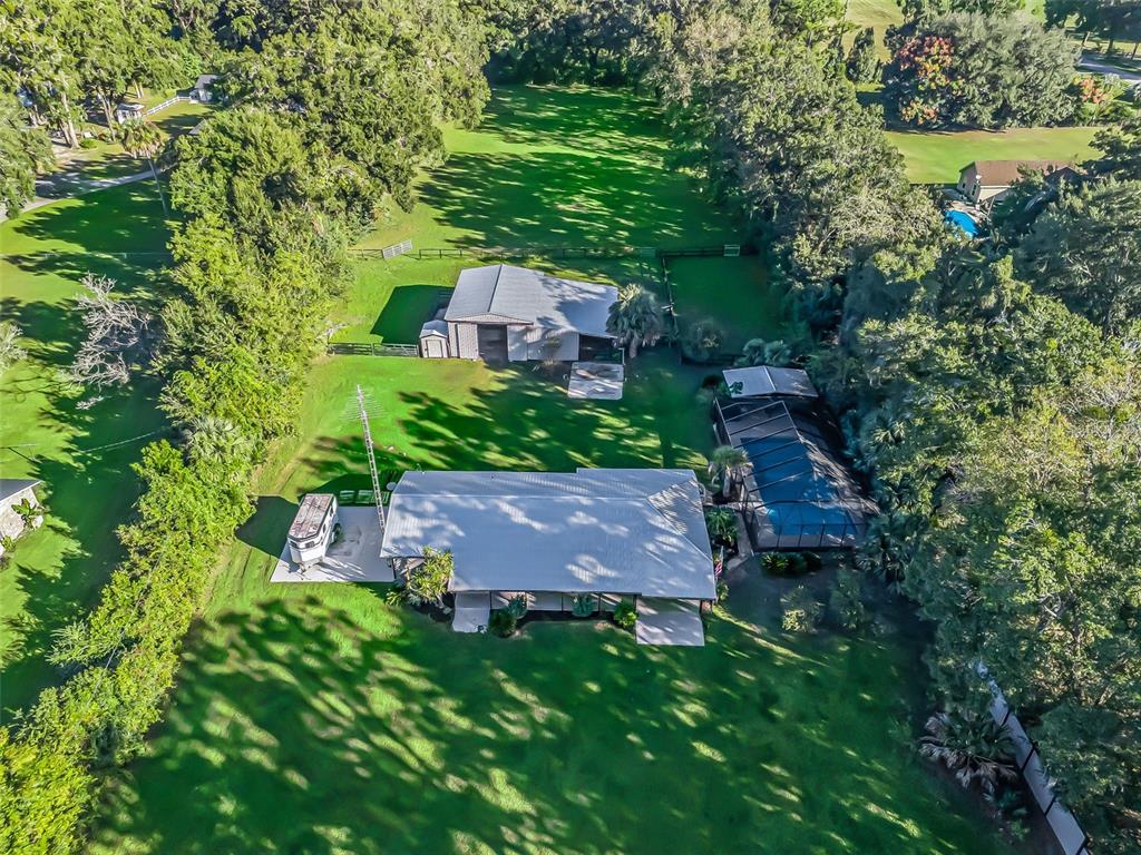 3505 Northeast 97th Street Road Anthony, FL 32617 - Photo 32 of 36 an aerial view of a house with a yard