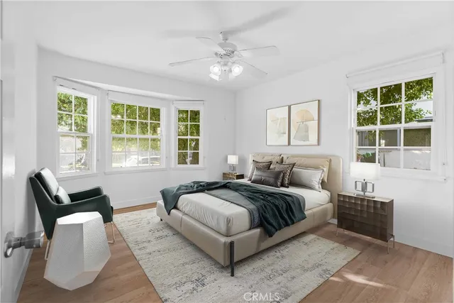 a spacious bedroom with a bed and a couch