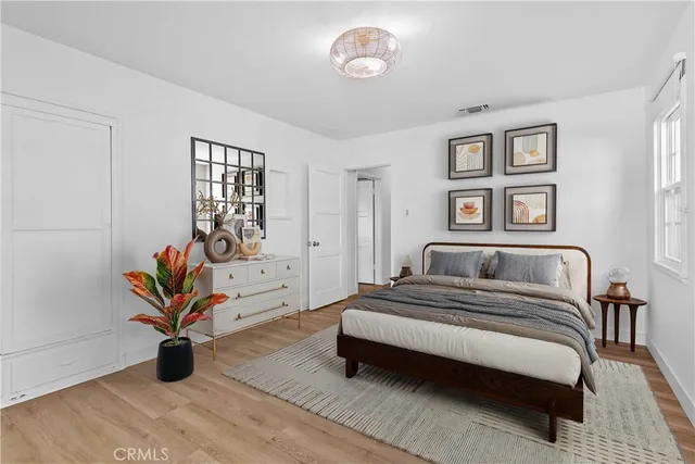 a bedroom with a bed and window