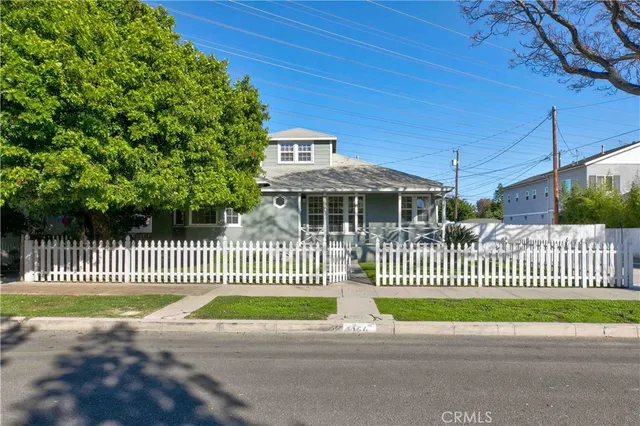 a view of a house with a fence