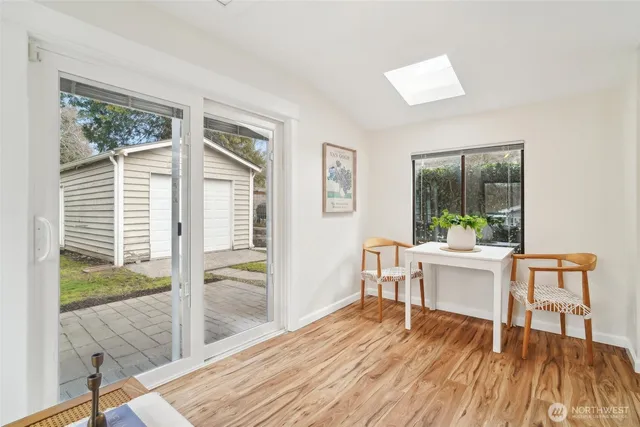 a work room with wooden floor and a window
