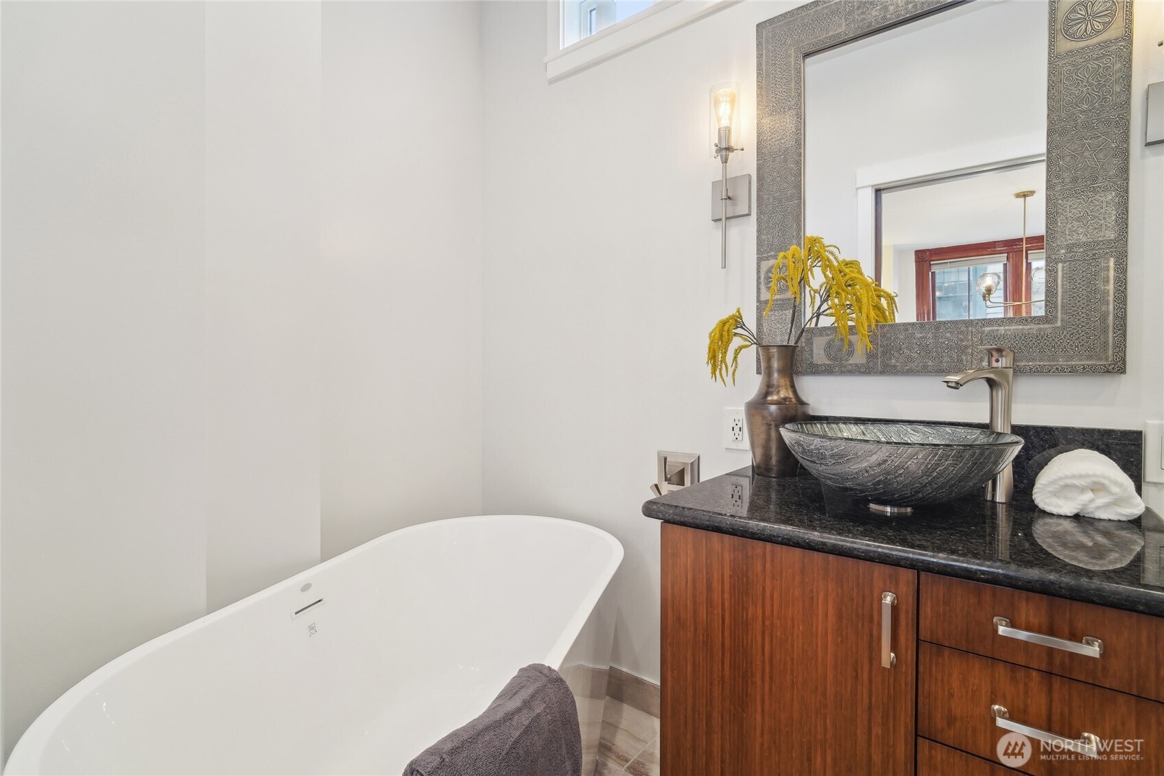 1420 North 50th Street Seattle, WA 98103 - Photo 16 of 32 a bathroom with a sink and a mirror