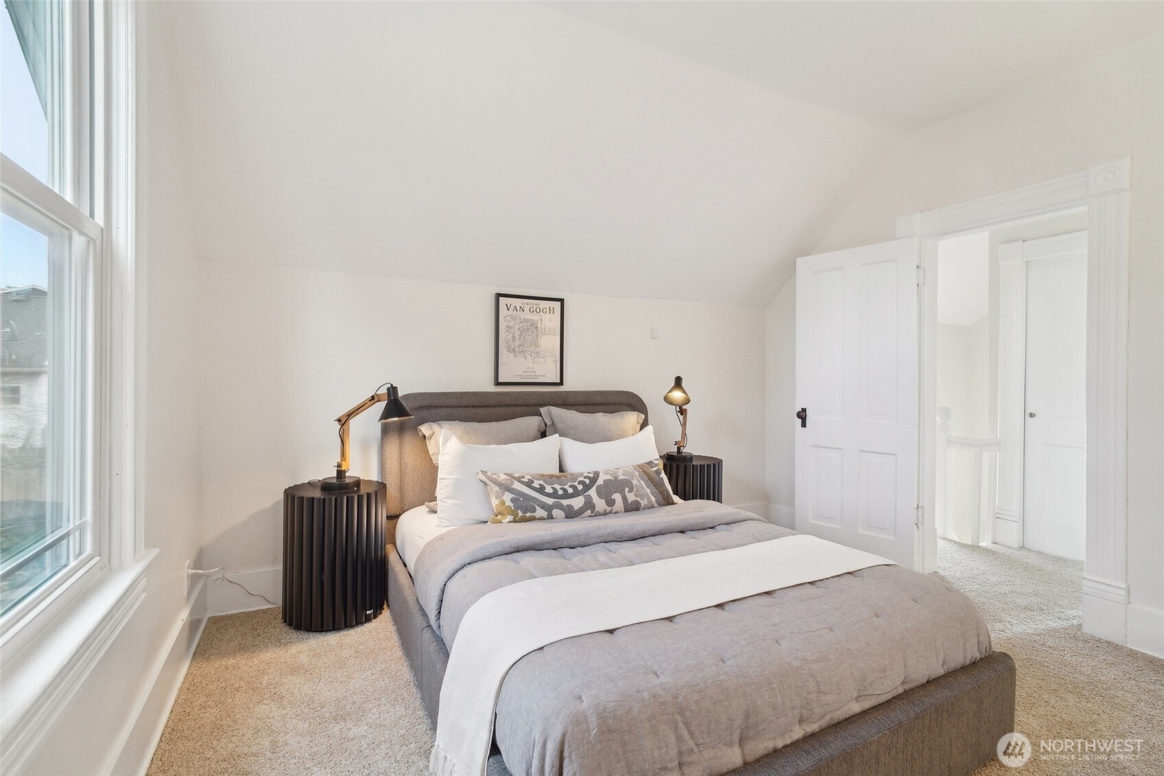 1420 North 50th Street Seattle, WA 98103 - Photo 17 of 32 a bedroom with a bed and a window