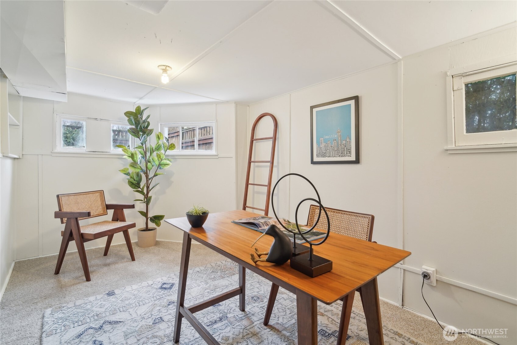 1420 North 50th Street Seattle, WA 98103 - Photo 23 of 32 a view of a workspace room with furniture and a potted plant