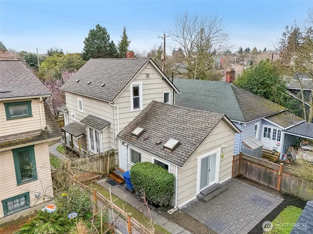 a aerial view of a house with a yard
