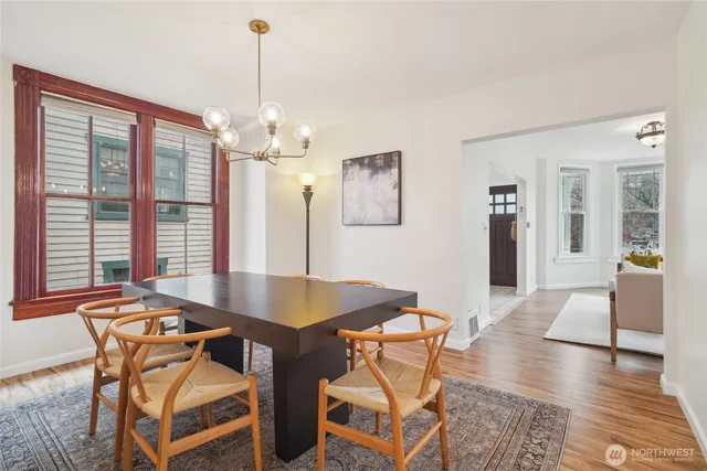 a dining room with furniture and window