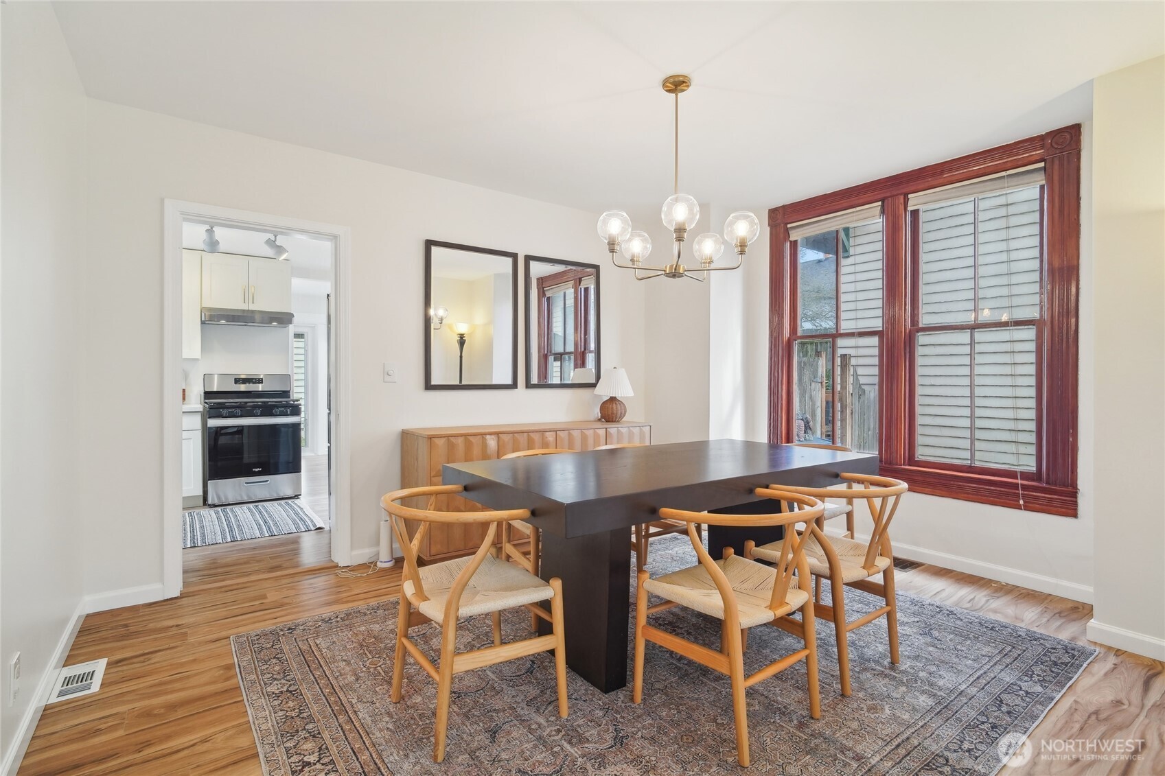 1420 North 50th Street Seattle, WA 98103 - Photo 7 of 32 a view of a dining room with furniture and chandelier