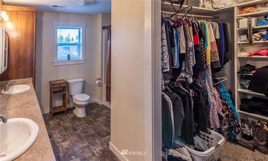 7122 Enterprise Road Ferndale, WA 98248 - Photo 18 of 33 a view of walk in closet with clothes and shoes