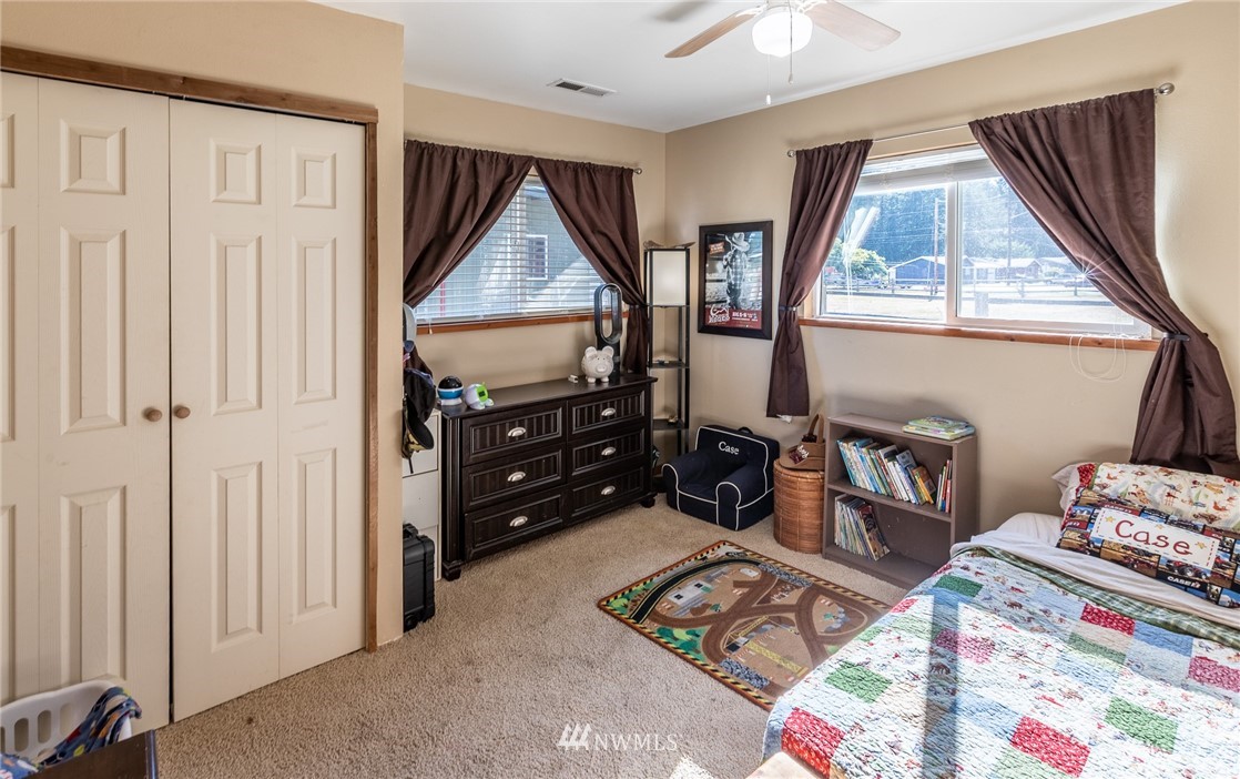7122 Enterprise Road Ferndale, WA 98248 - Photo 25 of 33 a bedroom with furniture and a window