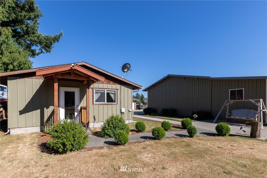 7122 Enterprise Road Ferndale, WA 98248 - Photo 5 of 33 a front view of a house with garage
