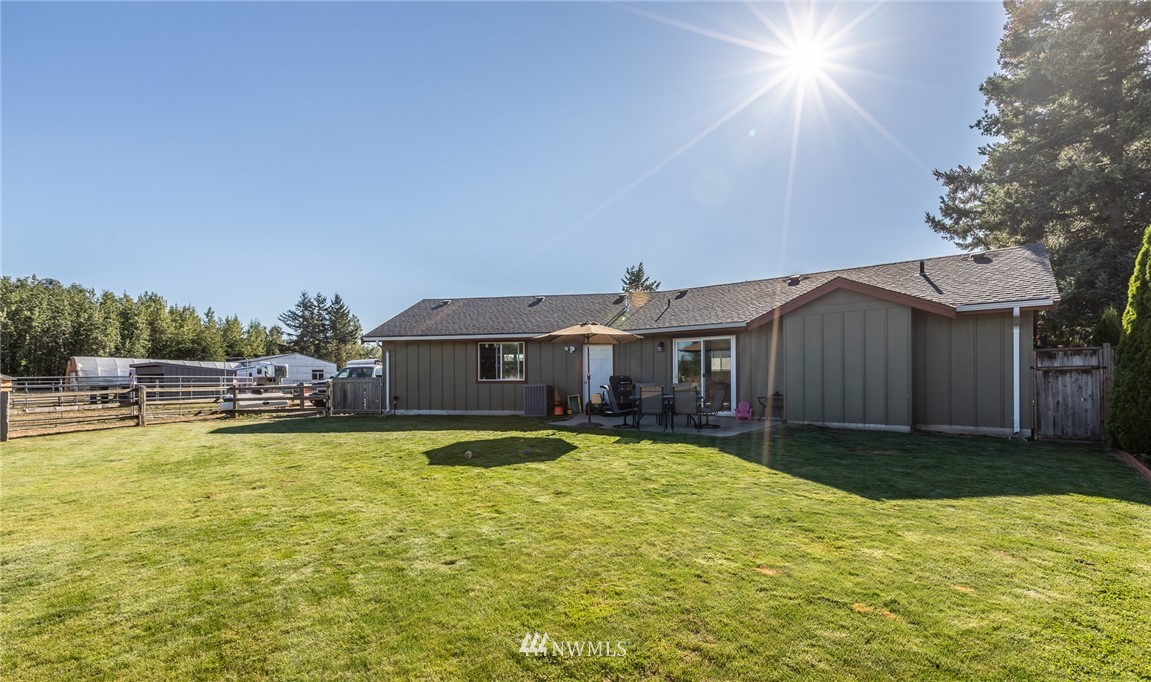 7122 Enterprise Road Ferndale, WA 98248 - Photo 6 of 33 a view of a house with swimming pool and a yard