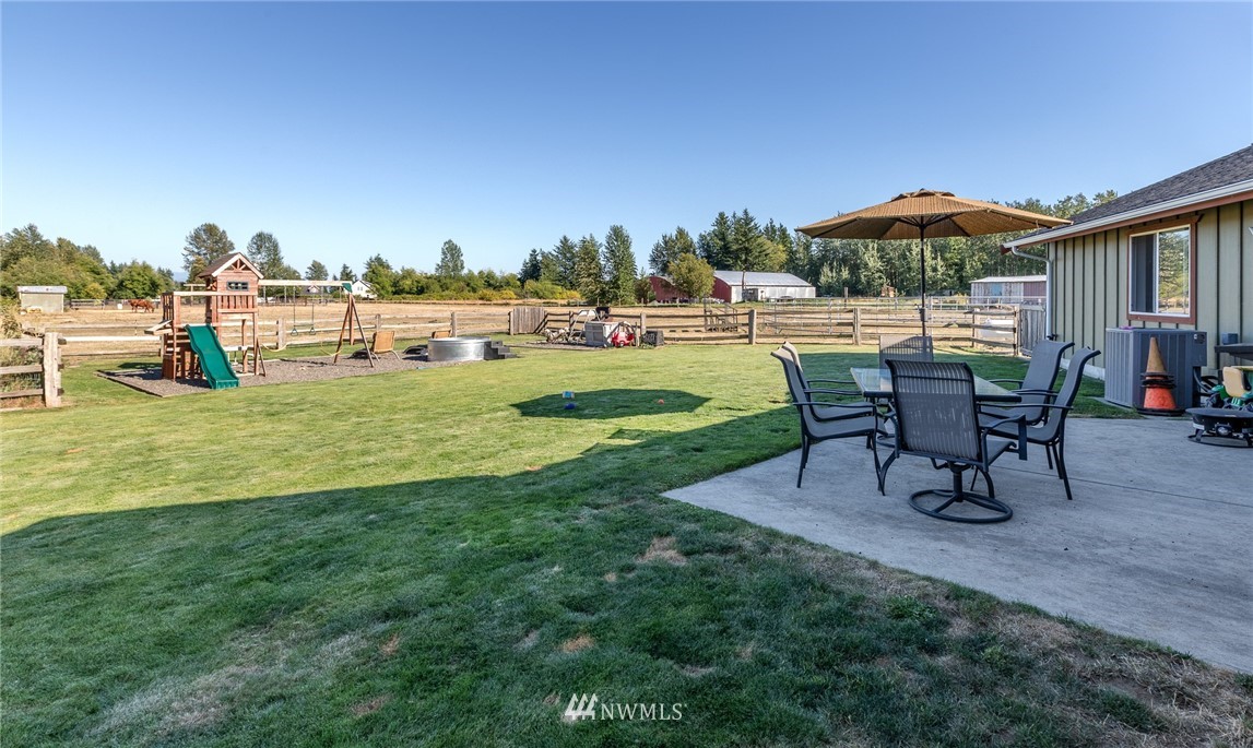 7122 Enterprise Road Ferndale, WA 98248 - Photo 7 of 33 a view of a house with a yard and sitting area