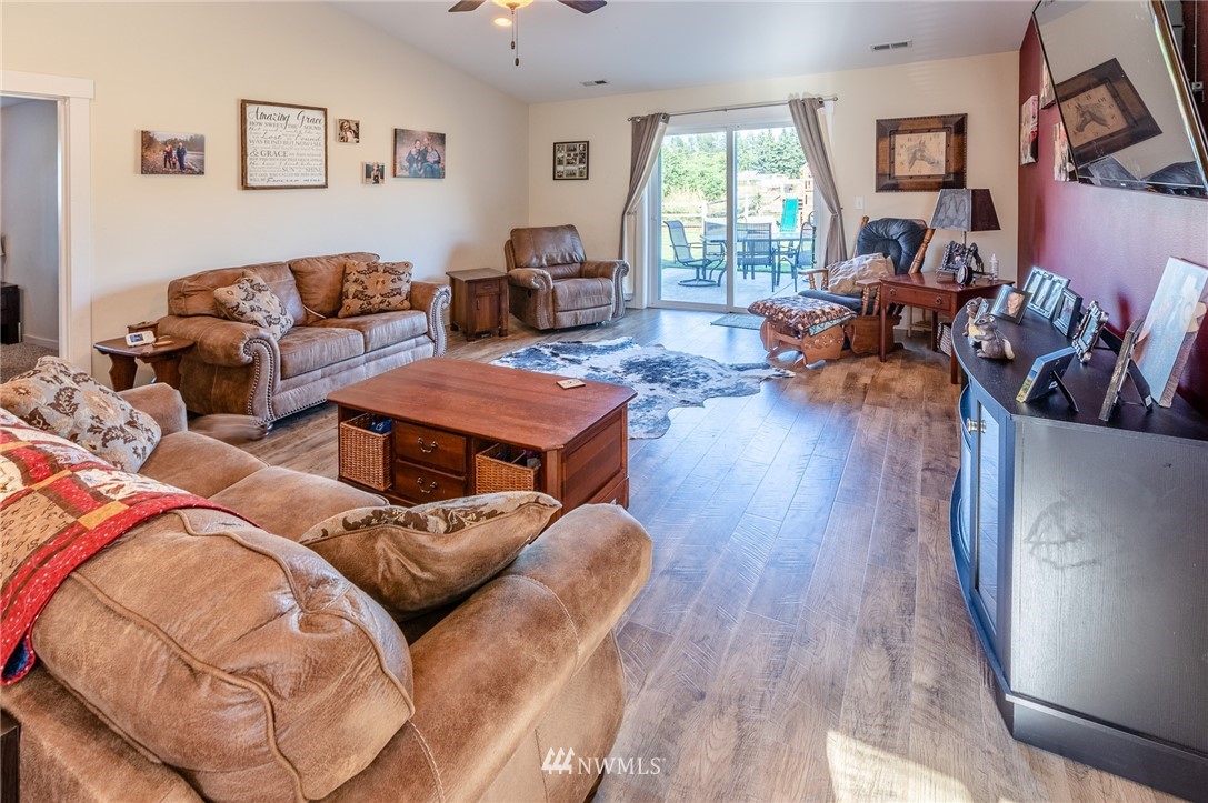 7122 Enterprise Road Ferndale, WA 98248 - Photo 10 of 33 a living room with furniture large window and wooden floor