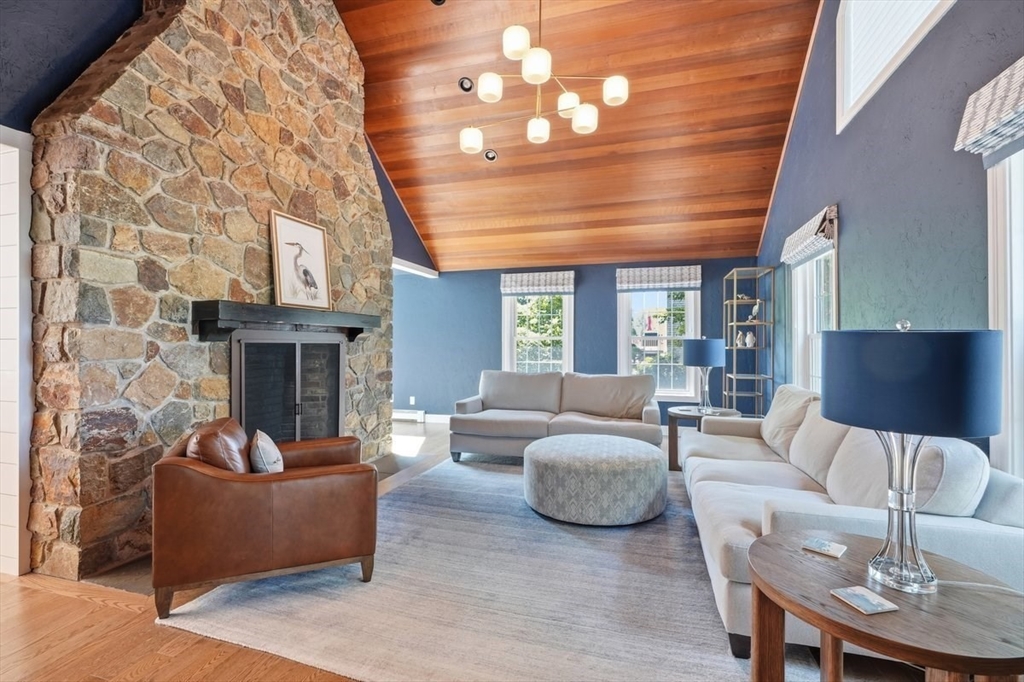 47 Old Coach Road Cohasset, MA 02025 - Photo 7 of 40 a living room with furniture a fireplace and a flat screen tv